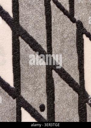 Macro view of a sparkly silver glitter background overlaid with irregular black painted lines forming a loose grid pattern. Visible paper fibers and r Stock Photo
