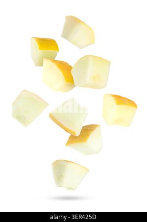 Sweet melon pieces falling against white background Stock Photo