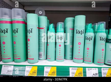 VORONEZH, Russia - March 14, 2026.A store shelf in Russia shows various Taft Volume hair styling mousse and sprays. The products are in mint green bot Stock Photo