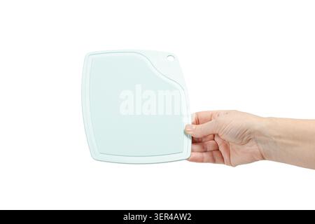 Woman holding a plastic cutting board on the white isolated background Stock Photo