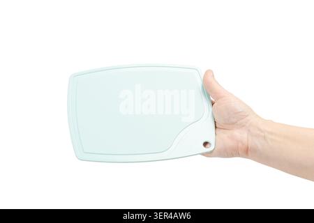 Plastic cutting board in the woman's hand on the white isolated background Stock Photo
