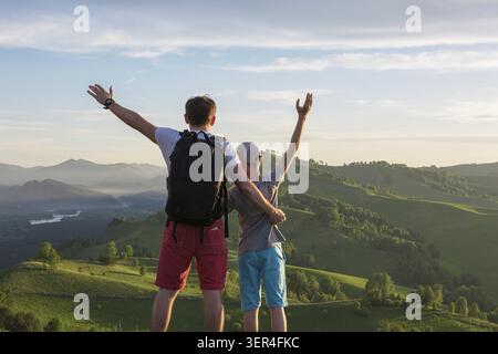 Happy father and son are walking in the Altai mountains Stock Photo