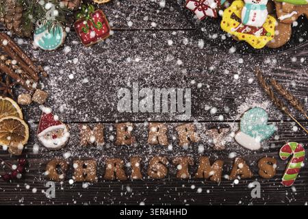 Gingerbreads and coffee for new years and christmas on wooden background, xmas theme Stock Photo