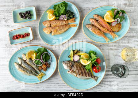 Assorted seafood plates with fish and appetizers on table Stock Photo