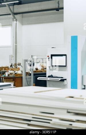Furniture workshop layout with tools and equipment in use during working hours Stock Photo