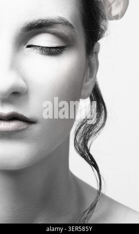 Portrait of beautiful dark haired slavonic model's half face Stock Photo