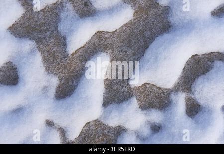 Snow patterns in the sand. Winter snow texture background Stock Photo
