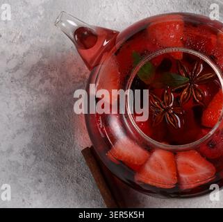 berry fruit tea with spices in a teapot Stock Photo