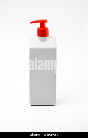 Neutral white rectangular plastic dispenser bottle with a vibrant red pump, providing a clean and customizable mockup for various liquid products like Stock Photo