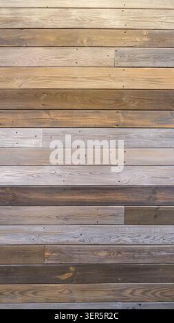 Horizontal wooden plank wall with mixed natural tones Stock Photo