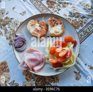 Grilled Cheese with Red Onion, Tomatoes and Salted Salad Stock Photo