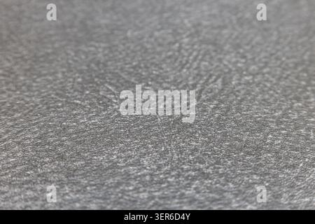 Macro view of a neutral grey textured textile surface showing fine material fibers Stock Photo