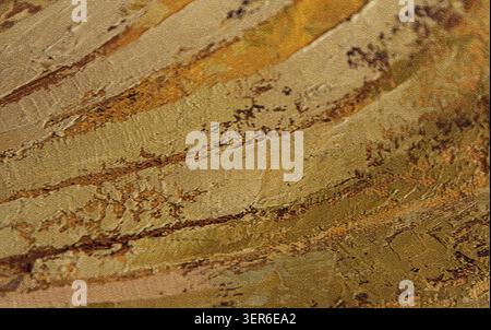 Abstract golden textured painted background with layered brush strokes and canvas surface Stock Photo