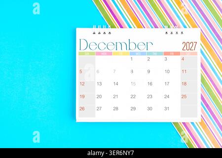 December 2027 Monthly desk calendar on blue color background, Position with copy space Stock Photo - Alamy