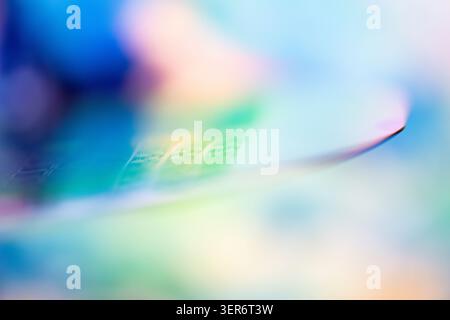 Silicon wafer displaying abstract iridescent colors and semiconductor chip patterns Stock Photo