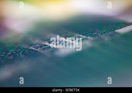 Abstract macro view of a semiconductor wafer surface showing intricate electronic patterns Stock Photo