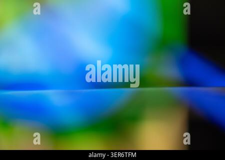 Abstract colorful light creating a blurred blue and green gradient Stock Photo
