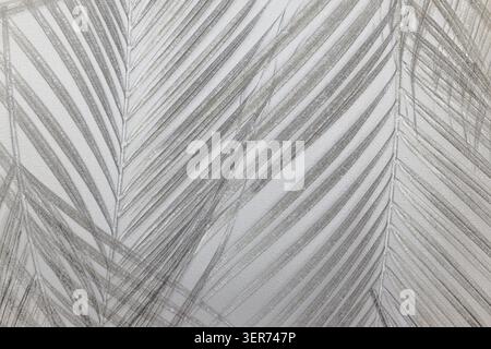 Palm leaf shadow pattern on textured wall Stock Photo