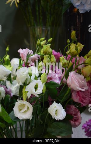 beautiful floral arrangements and bouquets with colorful hydrangeas and summer flowers in a rustic or outdoor setting. Moody and soft artistic editing. Stock Photo