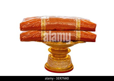 Traditional Thai Buddhist Monk Robes on Golden Pedestal Tray Isolated on Transparent Background Stock Photo