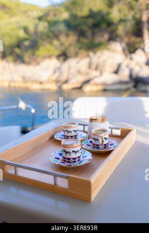 Turkish Coffee Cups on Wooden Tray by Seaside Stock Photo