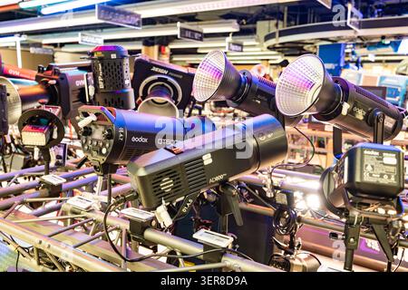 New-York, USA - April 7, 2026: Professional studio flash strobes and video lighting equipment on a display rack in a photo store Stock Photo