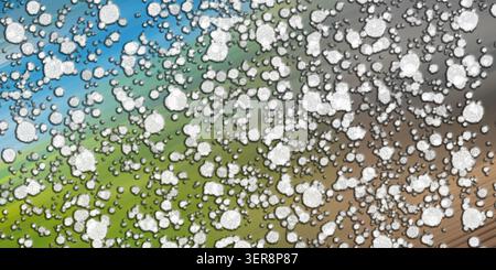 A vibrant abstract composition featuring white, textured, circular shapes layered over a multi-colored diagonal gradient background of blue, green, an Stock Photo