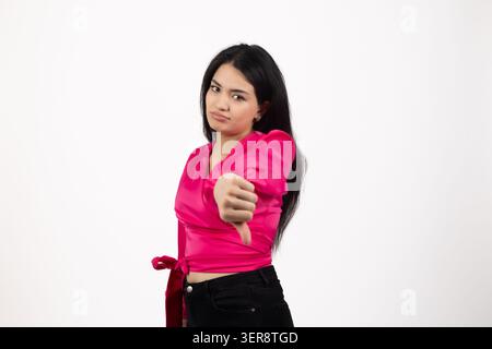 Serious young woman pointing index finger straight at camera confident Stock Photo