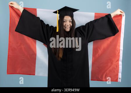 Graduate holding a Canadian flag Stock Photo