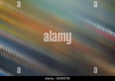A vibrant and complex abstract background with diagonal streaks of various colors including orange, blue, and brown, featuring a distinct grainy textu Stock Photo