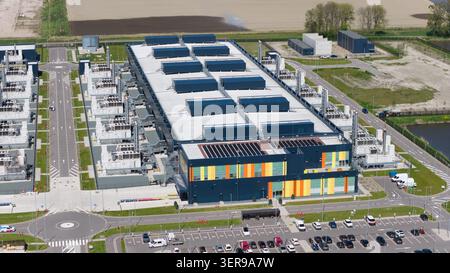 Drone aerial overview of a modern hyperscale datacenter campus in the Netherlands, showcasing cloud and AI computing infrastructure, servers, storage, Stock Photo