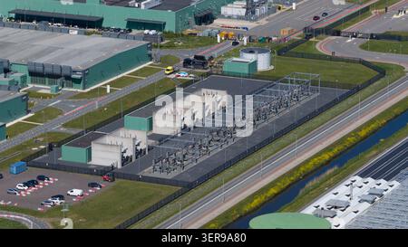 Aerial view of a modern datacenter campus with substation, transformers, and secure perimeter, illustrating big data, cloud computing, and AI infrastr Stock Photo