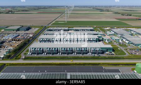 Aerial view of a modern datacenter campus in an industrial area, showcasing energy-efficient AI infrastructure, big data processing, cloud connectivit Stock Photo