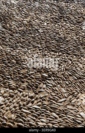 abstract closeup of handmade cobbled street surface in madeira Stock Photo