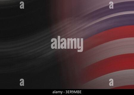 A creative abstract image featuring rhythmic red and blue stripes blending into a dark, grainy background with a strong sense of motion. Stock Photo