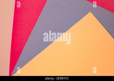 sheets of colored paper. Many colored sheets of paper are laid out in the harsh composition. background of colored paper. place for text. view from th Stock Photo