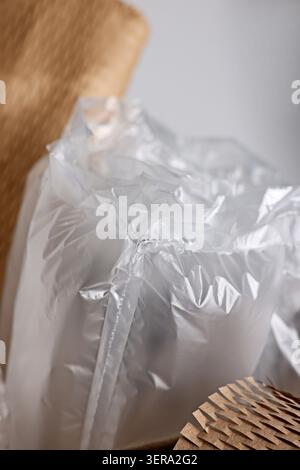 Air buffer packaging and honeycomb paper on light background, closeup Stock Photo