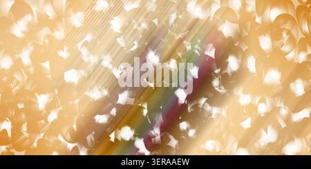 An abstract background featuring a warm golden hue with a multi-colored rainbow light streak cutting diagonally across a field of soft bokeh circles. Stock Photo