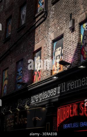 Liverpool, United Kingdom - 06 May 2026: View of the colorful Beatles portraits in the windows of the Rubber Soul Beatles Bar on a brick building in t Stock Photo