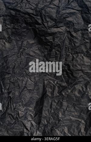 Vertical Black Crumpled Paper Texture Background Stock Photo