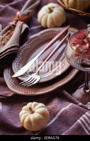Rustic autumn table setting with pumpkins and elegant tableware Stock Photo