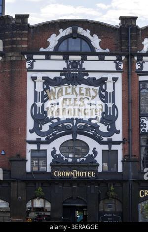 Liverpool, United Kingdom - 06 May 2026: View of the ornate facade of The Crown Hotel featuring historic Walker's Ales Warrington signage and Victoria Stock Photo