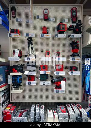 VORONEZH, Russia - April 8, 2026.A retail display rack shows various laser levels and measuring tools from Elitech and Condtrol in a Russian hardware Stock Photo