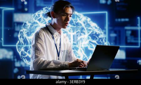 Computer scientist developing artificial intelligence neural networks architecture inspired by human brain. Dilligent worker setting up AI machine learning algorithms in high tech startup Stock Photo