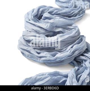 Light blue crinkled fabric scarf with delicate texture and soft folds, isolated on a clean white background, the textile material exhibits a subtle cr Stock Photo