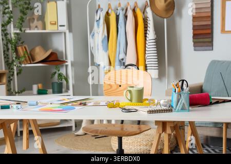 Fashion designers workplace with sewing supplies in studio Stock Photo