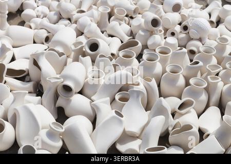 Many earthen pots kept for drying in the sun Stock Photo