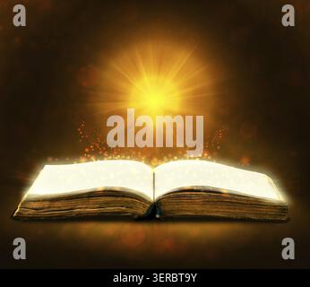 Old book with magic Ray of light Stock Photo