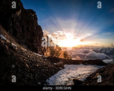 Sunset Rays over Mountain Glacier Stock Photo