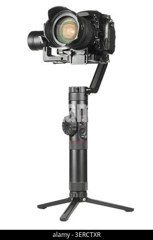 Gimbal three-axis motorized stabilizer with mounted DSLR camera isolated on white background Stock Photo